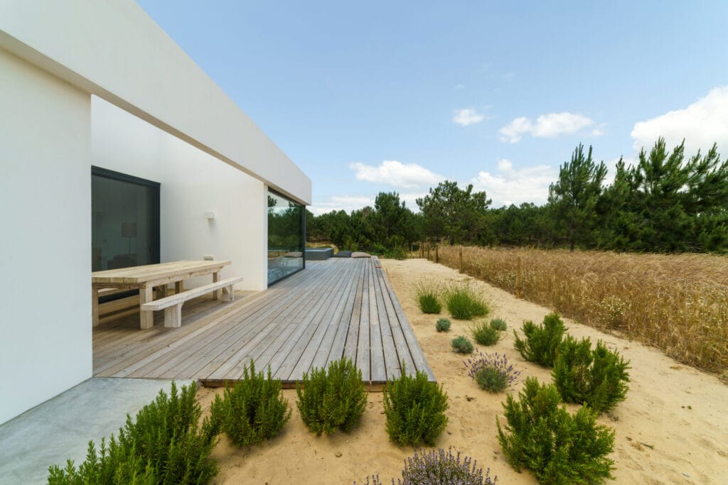 modern house with garden swimming pool and wooden deck