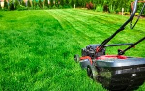 a lawn mower cutting grass 1080x675 1