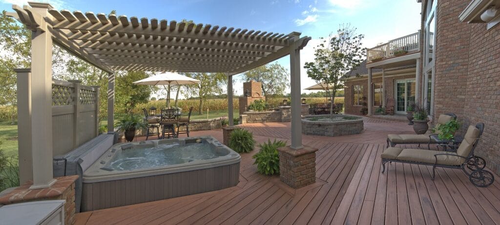 archadeck timbertech deck with vinyl pergola over spa