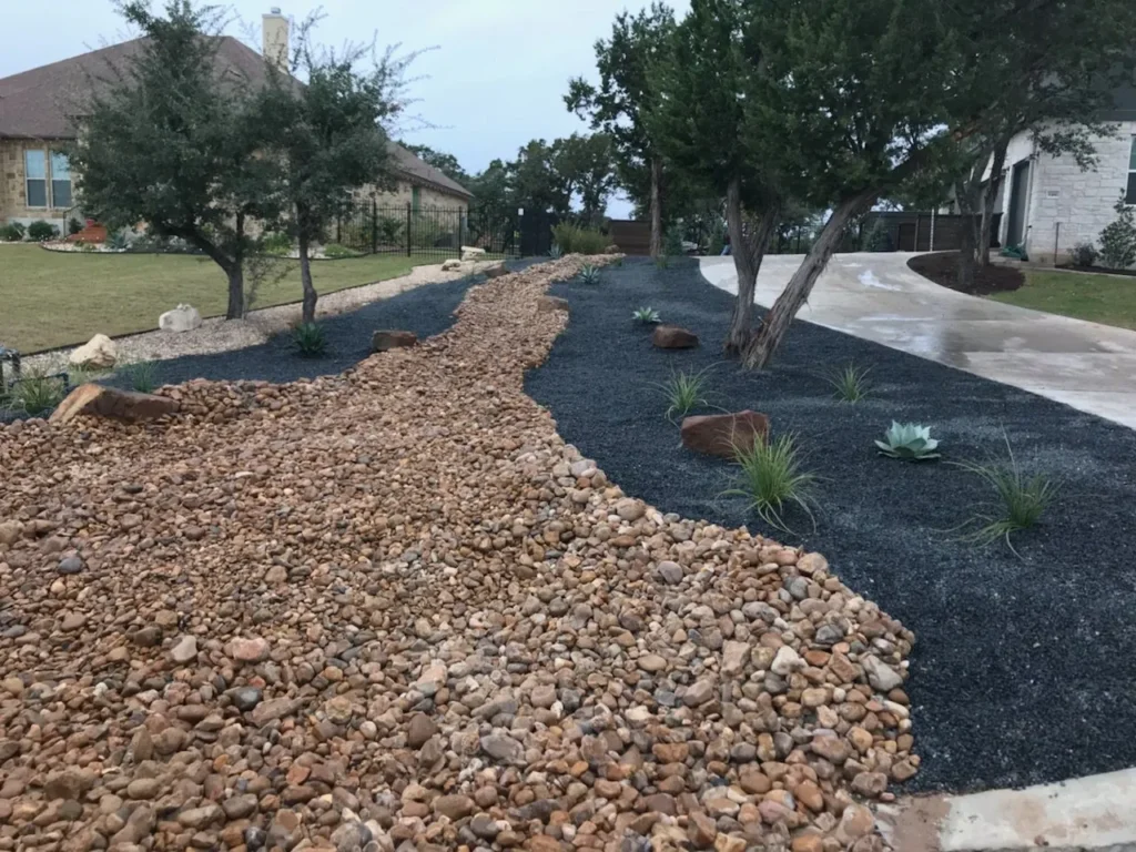 landscape installation riverbed for drainage spicewood tx